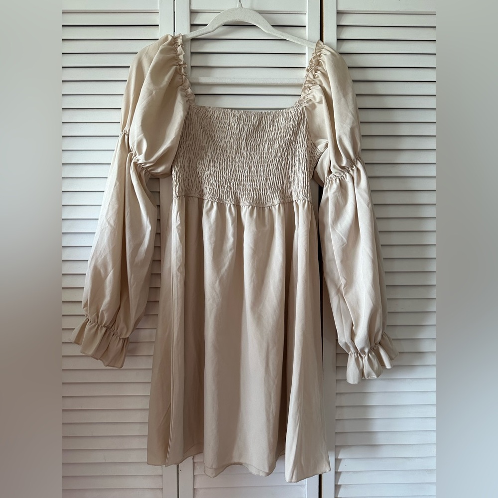 Tan puff sleeve smocked dress.